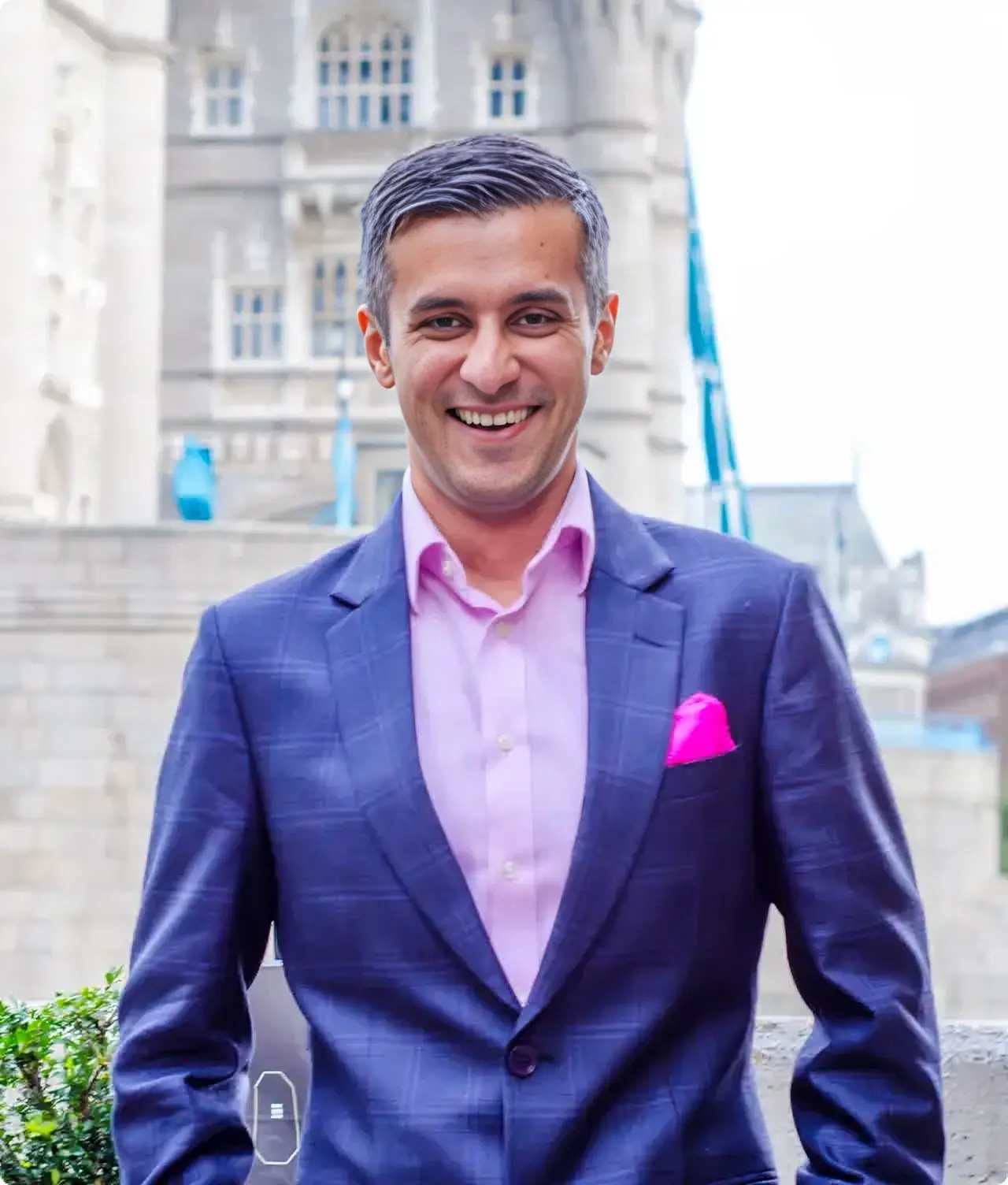 Raj Goodman Anand, AI keynote speaker, in front of Tower Bridge